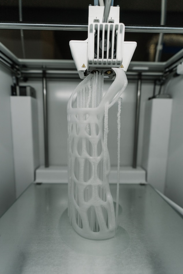 Alt-text: objecting being printed through 3-D printing